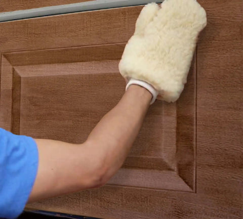 Wood Look Garage Door Paint Kit In English Oak Turns A Plain Door Into Real Wood Grain In A Two Step Morning Makeover With Easy Application And Durable Finish being applied with a mitt
