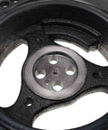 Close-up of Beefy Engine Harmonic Balancer Pulley For Ford 6.0L OHV V8 showing grooves and center holes, Part 3C3Z6312BA.