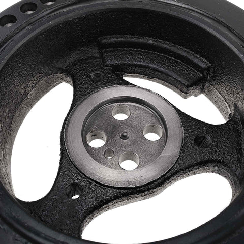 Close-up of Beefy Engine Harmonic Balancer Pulley For Ford 6.0L OHV V8 showing grooves and center holes, Part 3C3Z6312BA.