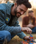 Man wearing 'Camping is In-Tents' pin from I Love Camp Pins For Kids 60 Pcs Outdoor Camping Button Accessories.