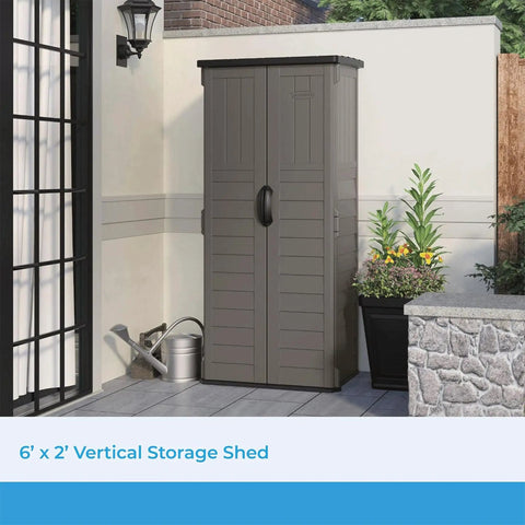 Vertical Outdoor Storage Shed With 22 Cubic Feet Of Capacity, Lockable Double Doors next to garden plants on patio.