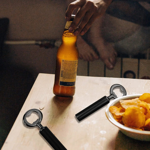 Ohiyoo metal bottle opener kit with black handle; two openers on a wooden table, one used to open a beer bottle.