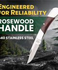 Compact 2.25 Inch Folding Pocket Knife With 440 Stainless Clip Point Blade Rosewood Handle shown against outdoor backdrop