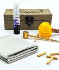 Elite Pro Grade Katana Care Kit With Real Choji Oil Copper Hammer Chamois Uchiko Ball And Mekugi Pegs displayed on white table.