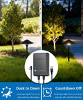 Go To All In One Outdoor Landscape Lighting Kit with 60 Watt Low Voltage Transformer and pathway light in garden at dusk