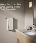 Bathroom with Elate 12-Inch Towel Bar In Vibrant Brushed Moderne Brass, modern bath hardware next to sink.