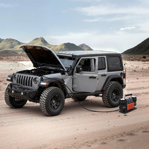 Heavy Duty Dual Cylinder Air Compressor Packed With 10.6 Cfm Quick Fill And Auto Shutoff next to a Jeep in a desert setting.