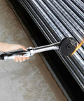 Person using the Three Inch Pneumatic Cut Off Tool With Six Replaceable Blades 18000 RPM High Speed Cutter on metal pipes.
