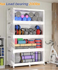 Big Ol 960 Quart Extra Large Stackable Storage Bins With Lid 4 Tier 240 Gallon Plastic Closet Organizer With Wheels And Clear Doors For Home Kitchen And Office White 4 Pack filled with exercise equipment in a room.