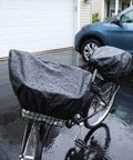 Heavy Duty Waterproof Bike Rack Cover With 60 Liters Rain Protection To Keep Treasures Dry On Outdoor Adventures And Sudden Showers For Most Bikes. black waterproof bike rack cover on rear basket, rain-covered, parked by a car
