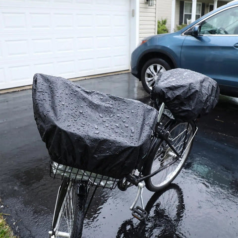 Heavy Duty Waterproof Bike Rack Cover With 60 Liters Rain Protection To Keep Treasures Dry On Outdoor Adventures And Sudden Showers For Most Bikes. black waterproof bike rack cover on rear basket, rain-covered, parked by a car