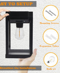 Hand holding Outdoor Solar Wall Lights 2 Pack With 3 Modes Dusk To Dawn Motion Sensor LED Sconce; screws, tubes, bulb shown