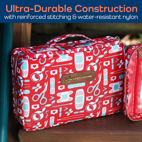 KeepGoing travel first aid kit bag, red patterned nylon with medical icons and brown logo patch; pink zip pouch nearby.