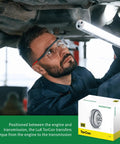 Mechanic inspecting undercarriage with illuminated torque converter, Beefed Up Torque Converter For Dodge Ram 2500 And Ram 3500 68RFE Transmission OE Replacement With Quad Plate Clutch And Heavy Torsion Damper For Smooth Lock Up And Improved Power Transfer