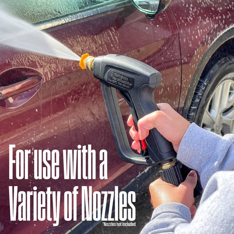 Using Short Pressure Washer Gun 3600 Max PSI With M22 Connector spraying foam on car panel, focus on gun and spray action.