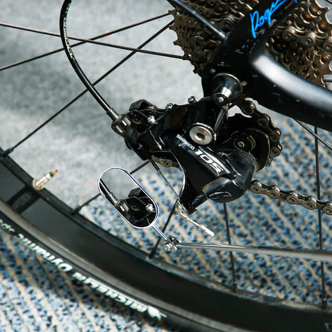 Pair Of Telescoping Inspection Mirrors Extend To 28 Inches With 360 Degree Rotation inspecting a bicycle gear area
