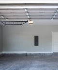 Overhead Garage Storage Rack Ceiling Mounted For Quick Space Saving Organization Of Tools Totes And Gear Durable Steel Construction Easy Install Heavy Duty Garage Shelving visible in empty garage space.