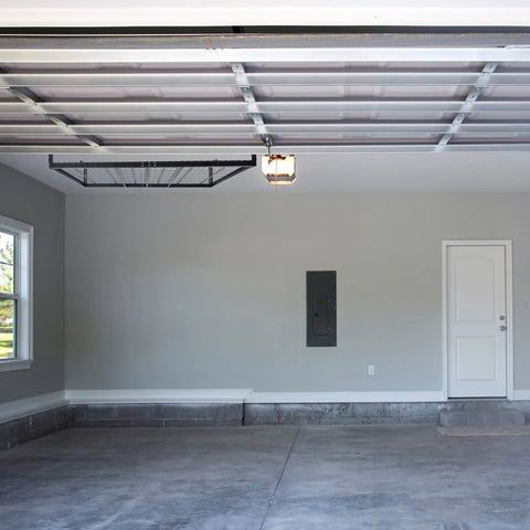 Overhead Garage Storage Rack Ceiling Mounted For Quick Space Saving Organization Of Tools Totes And Gear Durable Steel Construction Easy Install Heavy Duty Garage Shelving visible in empty garage space.