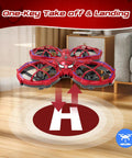 Mini Drone For Kids Beginners Toss To Go RC Quadcopter with LED lights in red spider-pattern hovering indoors