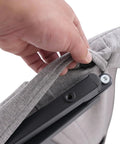 Hand adjusting the removable gray cushion cover on Heavy Duty Electric Bed Backrest With Guardrail For Elderly Support.