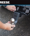 All In One Trailer Hitch Ball Mount Starter Kit Fits 2 Inch Square Receiver With 2 Inch Drop And 6,000 Lbs Capacity Includes 2 Inch Trailer Ball Pin And Clip For Easy Hookups being installed onto a vehicle
