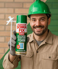 Heavy Duty Expanding Polyurethane Spray Foam 17 Oz Multi Purpose Gap Filler That Plugs Pesky Drafts Weatherproof Door Window Insulation Bonding Agent With Rock Solid Grip held by a man wearing gloves and a green hard hat.