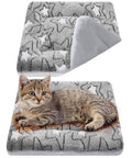 Self Warming Cat Mat And Self Heating Pet Bed That Traps Body Heat Machine Washable Reversible Crate Blanket with Cat on it.