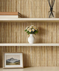 Super Slick Peel And Stick Grasscloth Wallpaper With Dead Simple Self Adhesive Backing For Modern Accent Walls And Apartment Rentals In Earthy Beige Tan Hues on a living room wall with shelves.