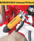 Close-up of yellow pistol-grip grease gun with quick-release coupler and 90° adapter.