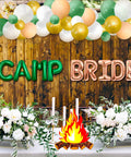 Bride To Be Camping Themed Bachelorette Bash Balloon Set with 'CAMP BRIDE' balloons and floral decor at cabin backdrop