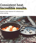 Seasoned 8 Quart Cast Iron Camp Dutch Oven With Lid Dual Handles Heavy Duty Camping Cookware over campfire with vegetables.