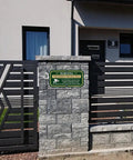 2 Pack Outdoor Security Warning Signs For Premises Guard Your Ground With 24 Hour Video And Audio Surveillance Alert on stone wall.