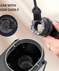 Close-up of Ayhira Adjustable Electric Burr Coffee Grinder with cleaning brush, showcasing easy maintenance for fresh ground beans.