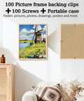 Light wood picture frame front with windmill landscape painting; adjacent frame back shows metal turn-fasteners.