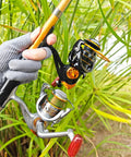Person holding freshwater and saltwater spinning reel with CNC alloy line cup 2000 size, chrome spool, gray design