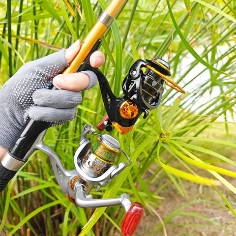 Person holding freshwater and saltwater spinning reel with CNC alloy line cup 2000 size, chrome spool, gray design