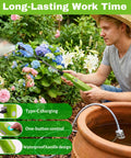 Man using Electric Sprayer Wand With 29 Inch Reach, 3 Adjustable Nozzles, Telescoping Garden Sprayer Tool in garden with flowers