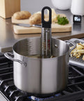 Curved Candy And Deep Fry Thermometer With Pro Grade Stainless Steel Paddle in pot showing precise temperature readings