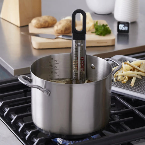 Curved Candy And Deep Fry Thermometer With Pro Grade Stainless Steel Paddle in pot showing precise temperature readings