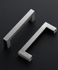 Two brushed nickel four and half inch cabinet handles square kitchen pulls for cabinets and drawers durable hardware on black background