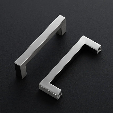 Two brushed nickel four and half inch cabinet handles square kitchen pulls for cabinets and drawers durable hardware on black background