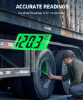 AstroAI heavy-duty digital tire pressure gauge with green backlit LCD, in-use on a truck tire valve