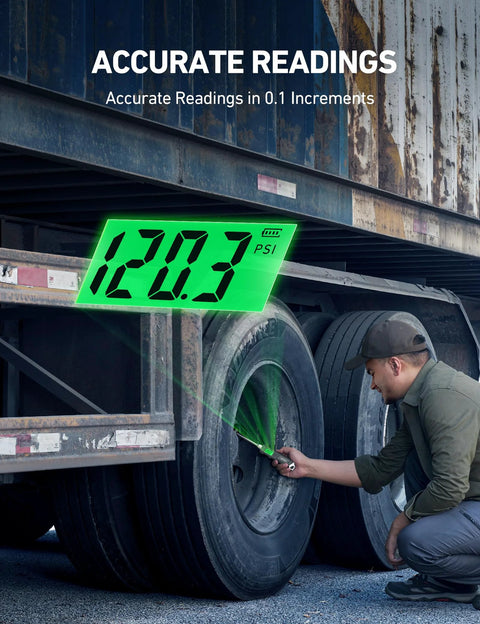 AstroAI heavy-duty digital tire pressure gauge with green backlit LCD, in-use on a truck tire valve