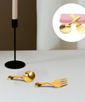 Portable Stainless Steel Camp Utensils Set With Pink Organizer Case For Outdoor Picnics Camping And Beach Trips on table