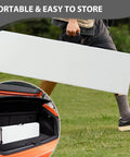 Person carrying a Heavy Duty 6ft Folding Bench With Secure Handle Lock Waterproof Patio Seat set in one hand, easy to store.