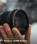 Person holding Circular Polarizer Filter 82mm with Pro Grade CinemaSeries Glass Anti Reflective Coating and Ultra Durable Aluminum Frame.