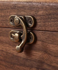 Close-up of vintage swing arm latch set in antique brass on wooden box. Vintage Swing Arm Latch Set In Antique Brass With Decorative Horn Lock Replacement Hardware For Jewelry Boxes Purses Cabinets Drawers Gift Boxes Cupboards Wooden Boxes Retro Charm And Super Easy Install. Method for closing boxes and cupboards securely.