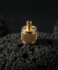 Professional Grade Beefy Brass Refrigeration Valve Caps With Slick Knurled Nozzles For Ac Systems And Coolant Lines Leak Proof Field Service Covers No Sweat Maintenance 30 Pack on black rock surface.