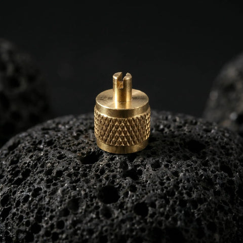 Professional Grade Beefy Brass Refrigeration Valve Caps With Slick Knurled Nozzles For Ac Systems And Coolant Lines Leak Proof Field Service Covers No Sweat Maintenance 30 Pack on black rock surface.