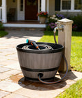 Brown Resin Garden Hose Pot With Removable Drain Plug, big capacity storage on patio with circular opening hose connection.